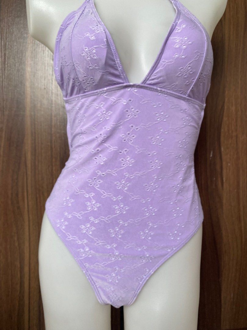 Swimsuit (Category: Bikinis & Swimsuits) located in Cavite. Submitted by jaydaascollection (Listing ID 1405579381, Image 3). Description: - Lavender halter neck swimsuit - Floral embroidery - Plunging neckline - High-waisted bottoms - Tie closure at neck and back - Soft, textured fabric - Ideal for beach or pool.