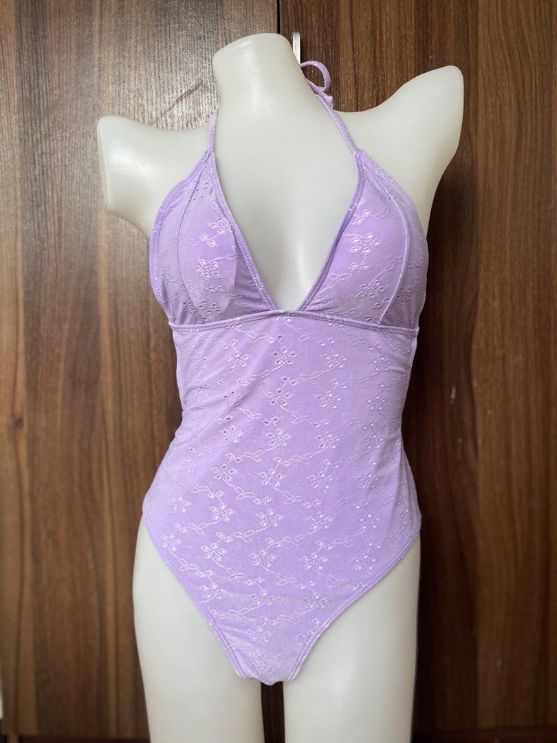 Swimsuit (Category: Bikinis & Swimsuits) located in Cavite. Submitted by jaydaascollection (Listing ID 1405579381, Image 2). Description: - Lavender halter neck swimsuit - Floral embroidery - Plunging neckline - High-waisted bottoms - Tie closure at neck and back - Soft, textured fabric - Ideal for beach or pool.