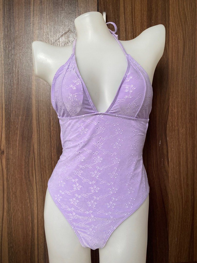 Swimsuit (Category: Bikinis & Swimsuits) located in Cavite. Submitted by jaydaascollection (Listing ID 1405579381, Image 1). Description: - Lavender halter neck swimsuit - Floral embroidery - Plunging neckline - High-waisted bottoms - Tie closure at neck and back - Soft, textured fabric - Ideal for beach or pool.
