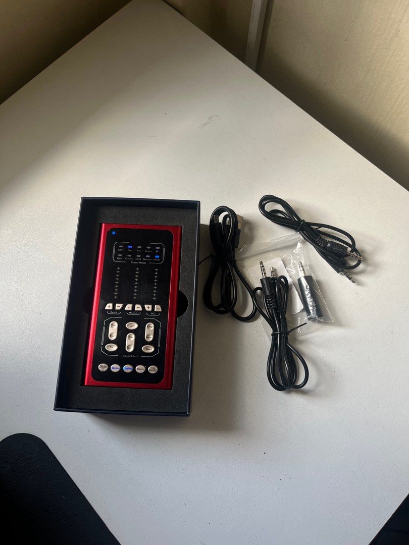 Sound Card (Category: Microphones) located in Quezon City. Submitted by hush_lowkey (Listing ID 1405649592, Image 3). Description: - Red sound card for condenser microphones - Features sound effect options and adjustment controls - Package includes: sound card, cables, and adapter - Ideal for live streaming and recording.