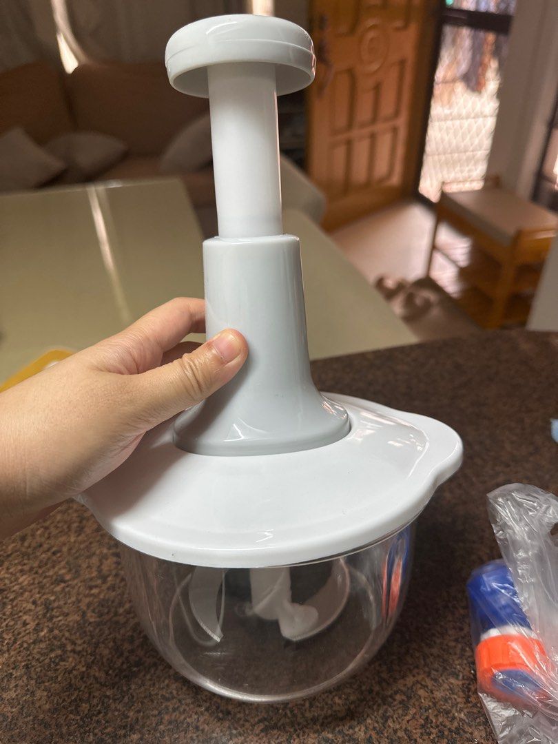 Manual Food Chopper (Category: Other Kitchen Appliances) located in Quezon City. Submitted by declutterbaby05 (Listing ID 1405586776, Image 1). Description: - Manual food chopper - Perfect for vegetables and fruits - Clear bowl - White lid with handle - Sharp blades - Convenient kitchen tool.
