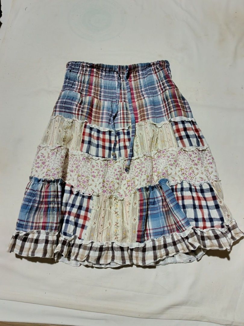 Patchwork Tiered Skirt (Category: Skirts) located in Manila. Submitted by aiesthetics (Listing ID 1405670275, Image 1). Description: offer not lower than 200 - Patchwork design with mixed patterns and colors - Tiered construction with a ruffled hem - Comfortable elasticized waistband - Made of lightweight fabric - Features plaid, floral, and solid fabric panels - Ideal for casual wear.
