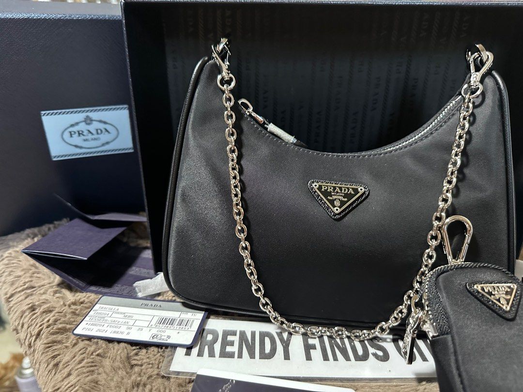 🇯🇵Prada Re-edition 2005 (Category: Luxury Bags & Wallets) located in Manila. Submitted by trendyfindscitrine (Listing ID 1405622339, Image 2). Description: Actual photo posted Made in Italy Comes with original box Materials canvass and Saffiano leather What you see is what you get .