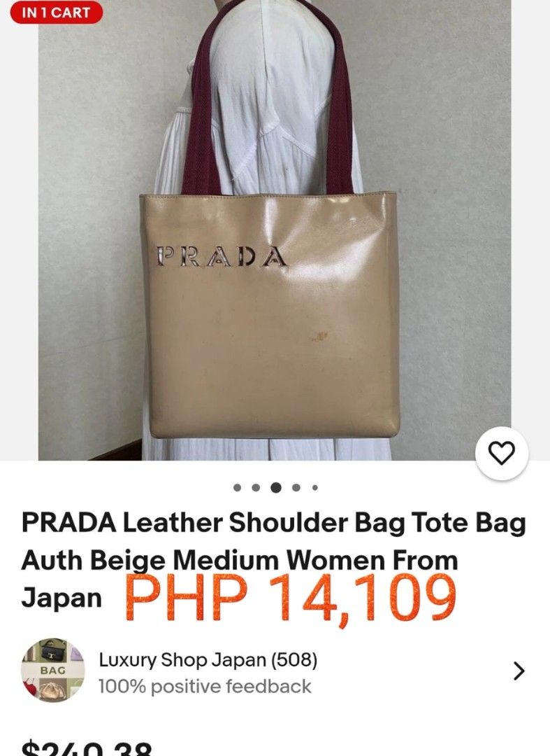 Preloved Prada Leather Shoulder Bag Tote Bag (Category: Luxury Bags & Wallets) located in Alicia. Submitted by celynahambotruecelyna39 (Listing ID 1405533302, Image 2). Description: - Authentic Prada shoulder bag - Beige exterior with burgundy straps - Includes a small matching pouch - Features the Prada logo - Medium-sized tote bag - Perfect for everyday use - Made in Japan.