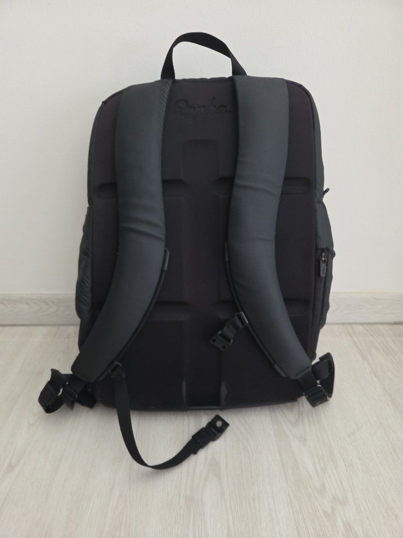 Rapha backpack (Category: Backpacks) located in Singapore. Submitted by damiankoh (Listing ID 1405566462, Image 3). Description: - Stylish black backpack - Multiple compartments for organised storage; zips all working - Padded shoulder straps for comfort - Suitable for work, school, and travel - Measures 40 x 28 x 12cm - Fits a 14-in laptop comfortably - Signs of wear, but still fully functional.