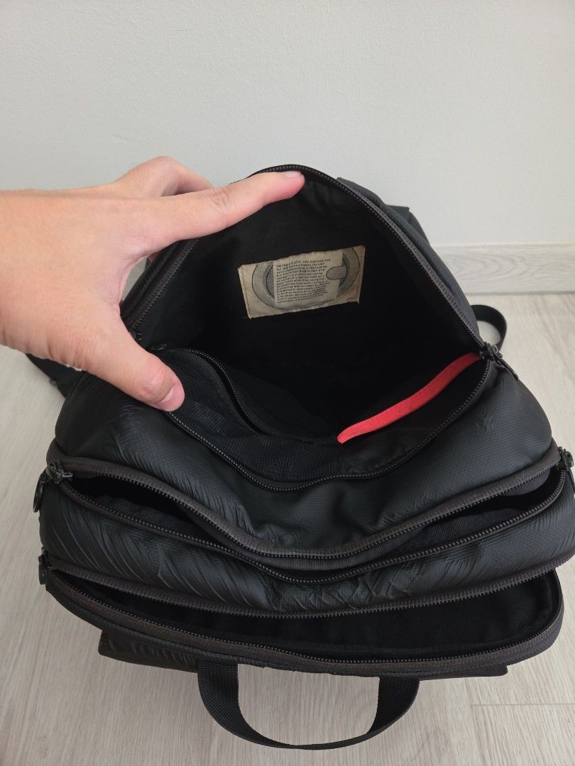 Rapha backpack (Category: Backpacks) located in Singapore. Submitted by dkjc81 (Listing ID 1405566462, Image 5). Description: - Stylish black backpack - Multiple compartments for organised storage; zips all working - Padded shoulder straps for comfort - Suitable for work, school, and travel - Measures 40 x 28 x 12cm - Fits a 14-in laptop comfortably - Signs of wear, but still fully functional.
