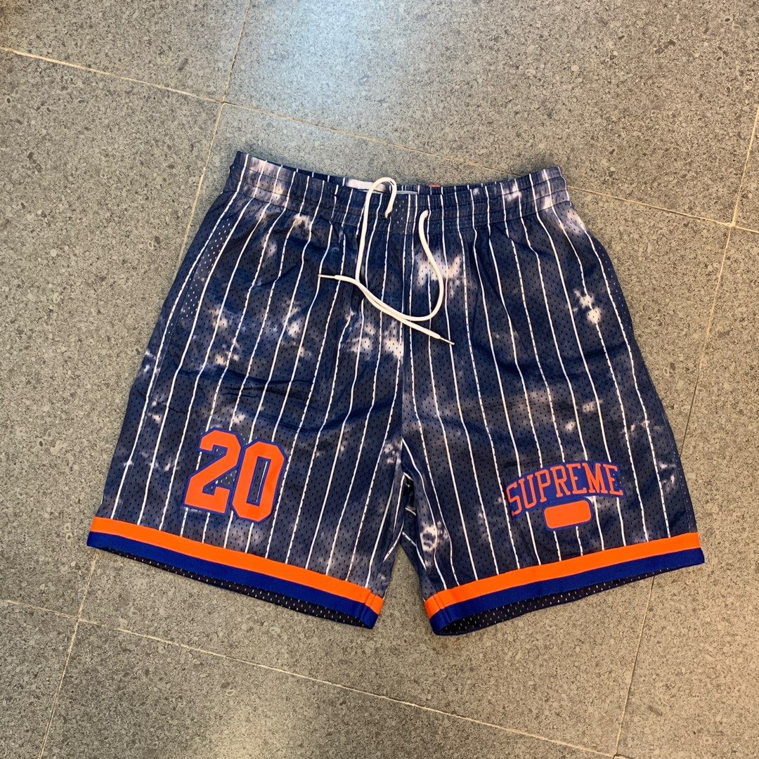 Supreme Newyork pinstripes shorts (Category: Shorts) located in Pasig City. Submitted by paymelikelandlord (Listing ID 1405586255, Image 1). Description: - Supreme basketball shorts - Color: Navy blue with white stripes - Features: "20" in orange (left leg), "SUPREME" logo (right leg) - Details: Drawstring waistband, orange and blue trim - Size: XL Supreme Newyork pinstripes shorts Excellent condition like new deadstock ❗️ No hidden issue no flaw