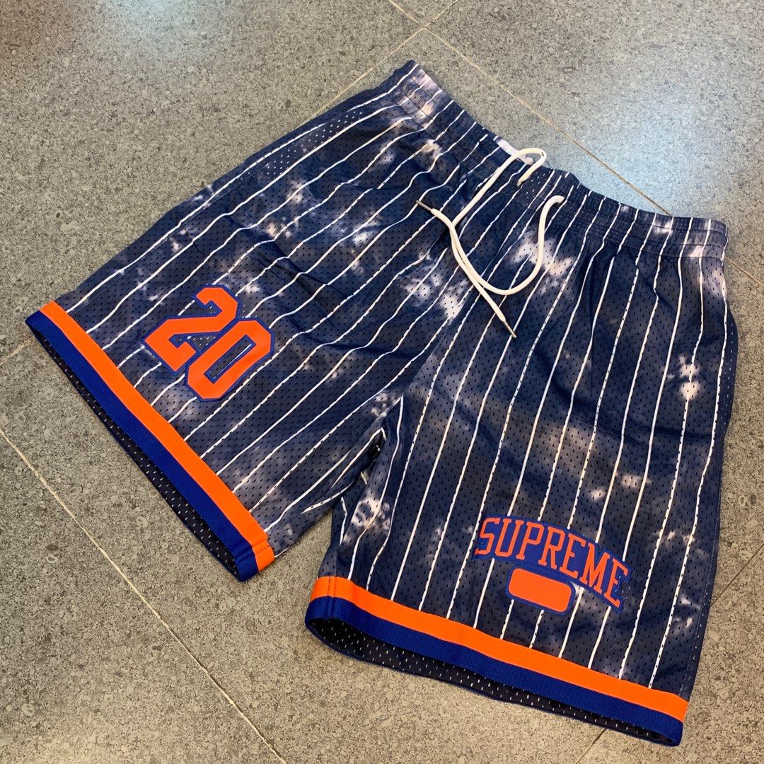Supreme Newyork pinstripes shorts (Category: Shorts) located in Pasig City. Submitted by paymelikelandlord (Listing ID 1405586255, Image 2). Description: - Supreme basketball shorts - Color: Navy blue with white stripes - Features: "20" in orange (left leg), "SUPREME" logo (right leg) - Details: Drawstring waistband, orange and blue trim - Size: XL Supreme Newyork pinstripes shorts Excellent condition like new deadstock ❗️ No hidden issue no flaw