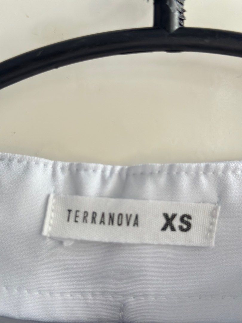 Terranova XS White Pleated Shorts (Category: Shorts) located in Quezon City. Submitted by mkme2003 (Listing ID 1405555906, Image 2). Description: - Terranova white pleated shorts - Size: XS - High-waisted - Material: Smooth, likely synthetic fabric - Versatile and classic style.