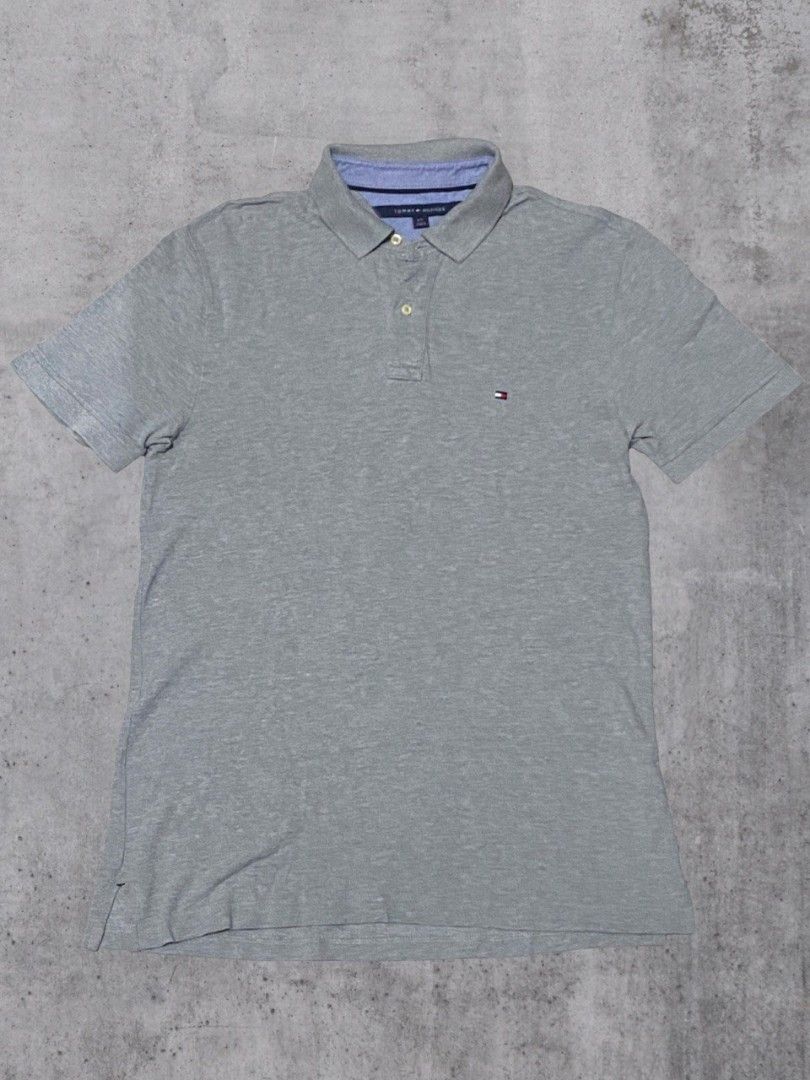 Tommy Hilfiger Grey Polo Shirt (Category: Tshirts & Polo Shirts ) located in Pasig City. Submitted by bye_bye1 (Listing ID 1405641063, Image 1). Description: Tommy Hilfiger Polo Shirt - Color: Grey - Size: L/G - Features Tommy Hilfiger logo - Classic polo collar and short sleeves - Made in Cambodia - Button-up placket - Includes extra button - Includes washing instructions tag Price: 500 Pasig Location.