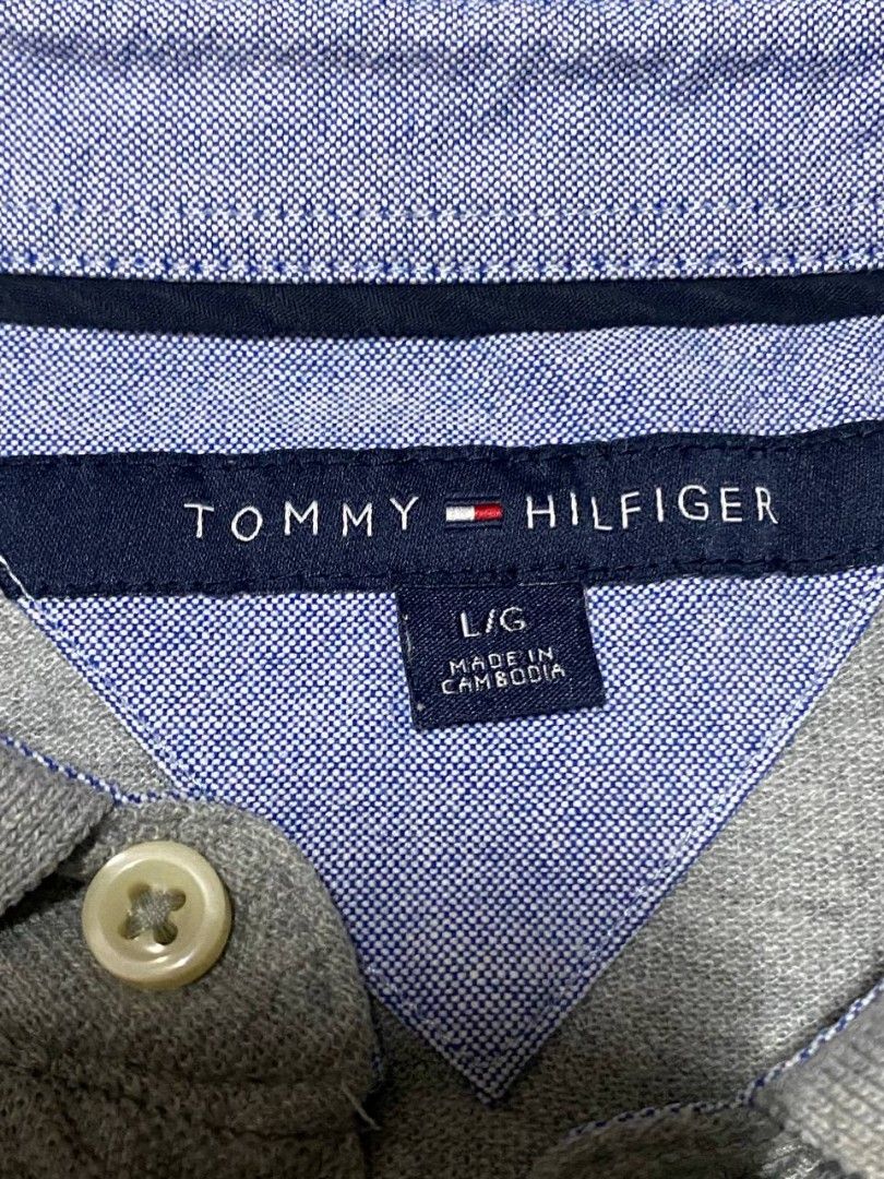 Tommy Hilfiger Grey Polo Shirt (Category: Tshirts & Polo Shirts ) located in Pasig City. Submitted by bye_bye1 (Listing ID 1405641063, Image 2). Description: Tommy Hilfiger Polo Shirt - Color: Grey - Size: L/G - Features Tommy Hilfiger logo - Classic polo collar and short sleeves - Made in Cambodia - Button-up placket - Includes extra button - Includes washing instructions tag Price: 500 Pasig Location.
