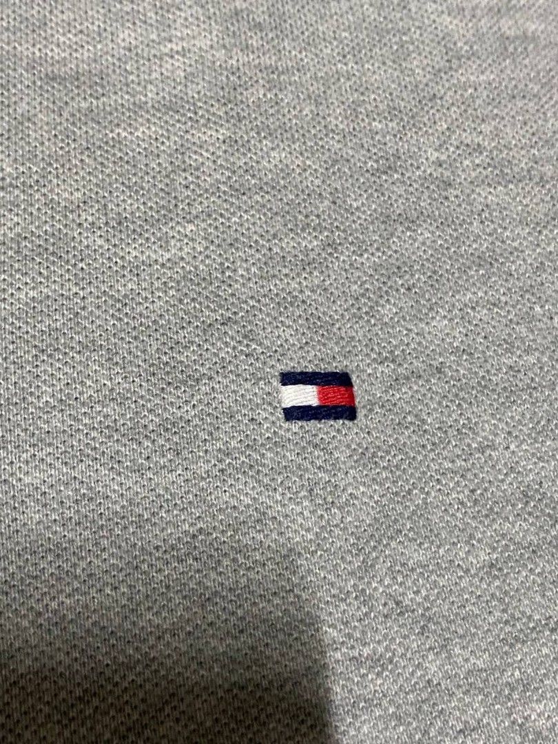 Tommy Hilfiger Grey Polo Shirt (Category: Tshirts & Polo Shirts ) located in Pasig City. Submitted by bye_bye1 (Listing ID 1405641063, Image 3). Description: Tommy Hilfiger Polo Shirt - Color: Grey - Size: L/G - Features Tommy Hilfiger logo - Classic polo collar and short sleeves - Made in Cambodia - Button-up placket - Includes extra button - Includes washing instructions tag Price: 500 Pasig Location.
