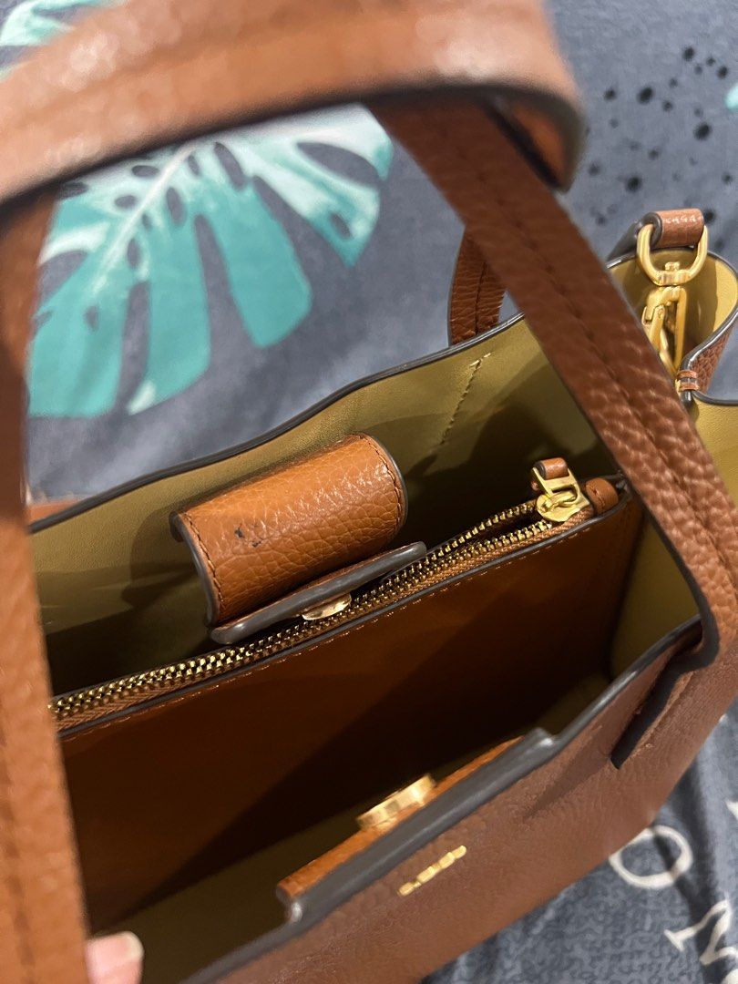 Tory Burch bag (Category: Luxury Bags & Wallets) located in Cebu City. Submitted by jasminfernandez (Listing ID 1405607170, Image 3). Description: - Tory Burch bag - Brown leather exterior - Top handle - Spacious interior with zippered pocket - Gold-tone hardware - Tory Burch logo on front - Suitable for everyday use - Bought in the USA RFS: Decluttering because I have so many bags.