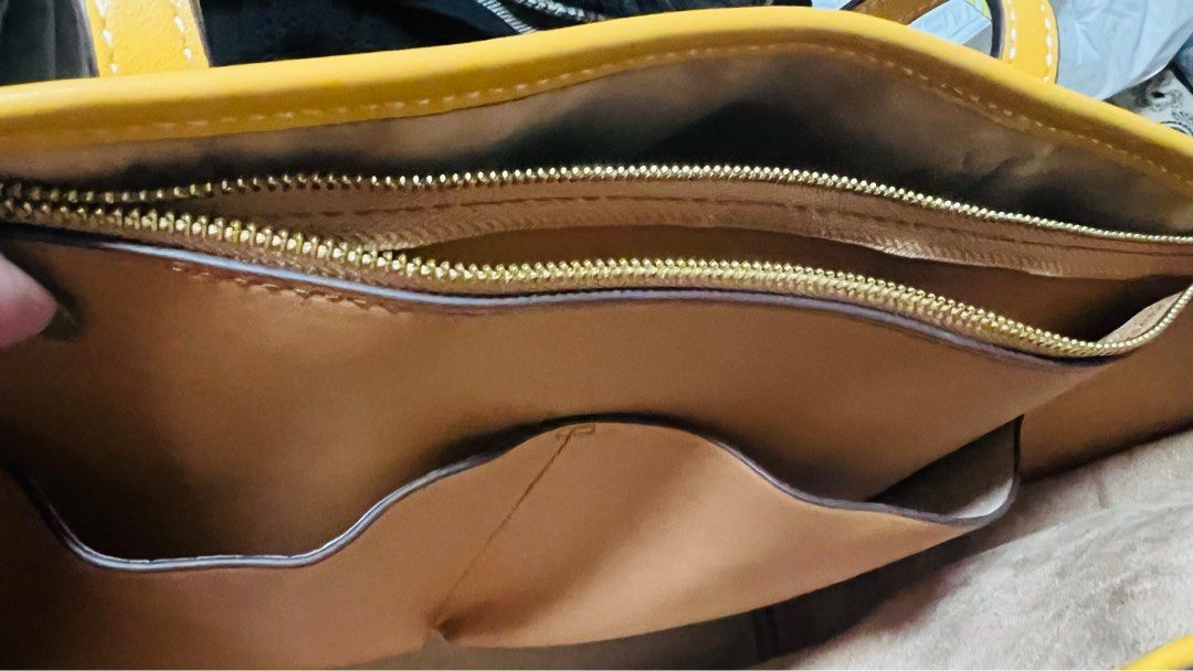 Tory Burch Perry T Monogram Triple-Compartment Tote (Category: Luxury Bags & Wallets) located in Quezon City. Submitted by kishey (Listing ID 1405640139, Image 2). Description: - rub in one corner but very minimal lang • Height: 11.4 inches to 11.5 inches (29.0 cm) • Length: 14.2 inches to 14.3 inches (36.0 cm) • Depth: 5.3 inches (13.4 cm) - Authentic Tory Burch tote bag - Yellow leather trim and handles - Monogram pattern - Interior zippered po