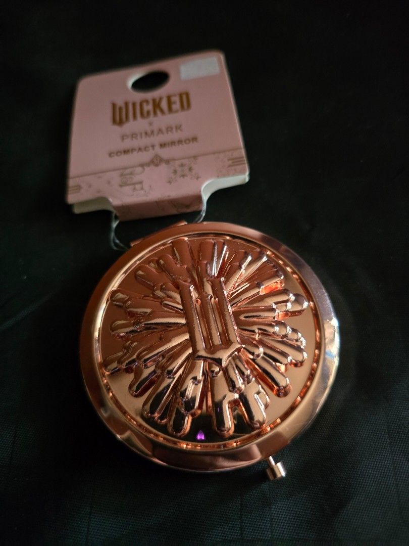 Wicked Compact Mirror (Category: Face Care) located in Marikina City. Submitted by wigglywiggy (Listing ID 1405565487, Image 2). Description: - Primark Wicked compact mirror - Elegant rose gold finish - Intricate exterior design - Contains two mirrors - Brand new with original tag - Ideal for on-the-go touch-ups.