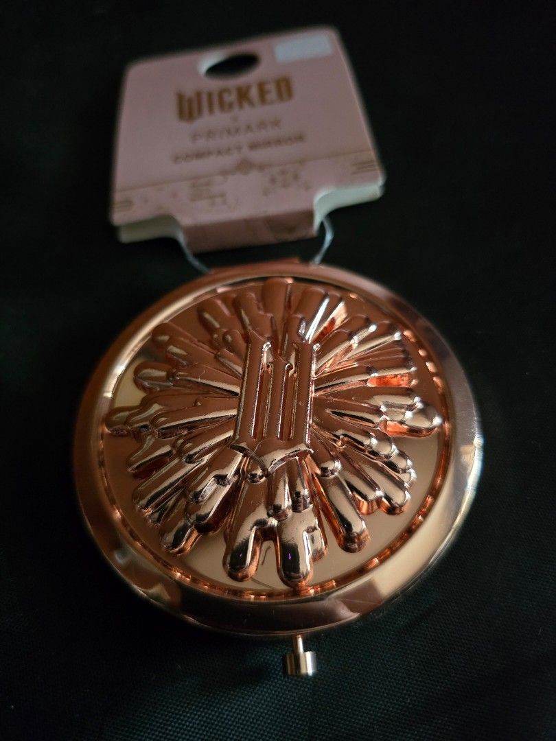 Wicked Compact Mirror (Category: Face Care) located in Marikina City. Submitted by wigglywiggy (Listing ID 1405565487, Image 3). Description: - Primark Wicked compact mirror - Elegant rose gold finish - Intricate exterior design - Contains two mirrors - Brand new with original tag - Ideal for on-the-go touch-ups.