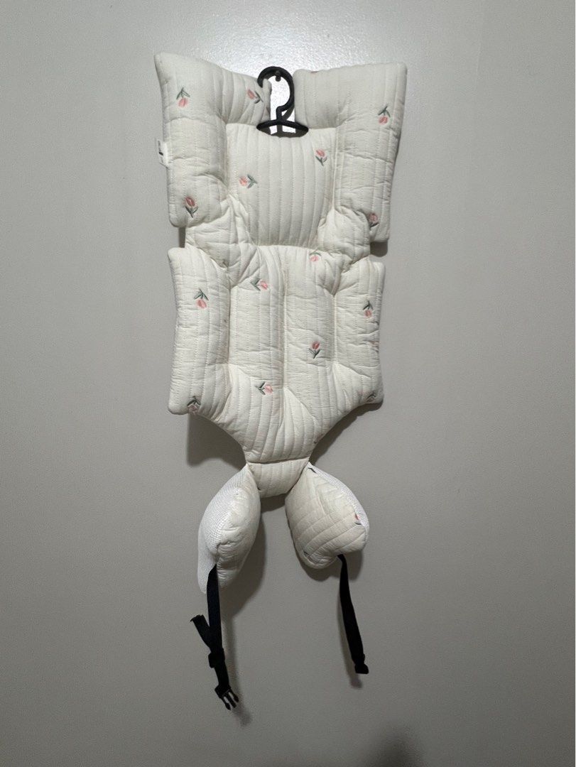 Baby Stroller Pad with Floral Design (Category: Strollers) located in Mandaluyong City. Submitted by prelovedbyshayne (Listing ID 1405854965, Image 1). Description: - Soft, quilted baby stroller pad for added comfort. - Unique shape with head and side supports. - Includes straps for secure attachment. - Features a delicate floral pattern. - White color. - Convenient hook for easy storage. Price:300+sf Loc: Mandaluyong MOP: Gcash/BDO RFS:declutter
