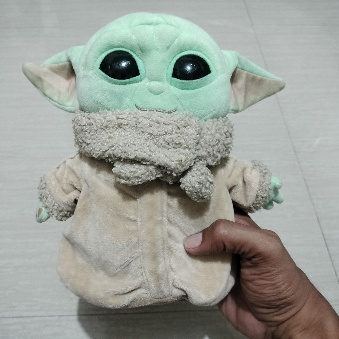 BABY YODA STUFFED TOY (Category: Plushies & Soft Toys) located in Sariaya. Submitted by social_animalz (Listing ID 1405873551, Image 1). Description: 9 iches with minimal scratch sa eye shipping fee is not included.