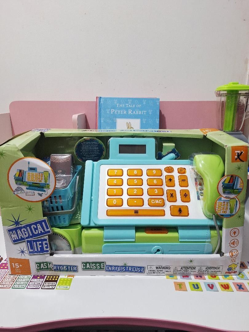 Cash Register Toy Set (Category: Kids Toys) located in Imus. Submitted by playfindsbyeli (Listing ID 1405712693, Image 2). Description: 🌟 Brand new Cash Register Toy Set 🌟 Super laki in actual, perfect gift this Christmas 🌟 Comes with barcode for scanning, microphones, grocery basket, accessories, and 3 AA batteries 🌟 French language Available colors: Tiffany Blue Grey/Pink Grey/Blue.