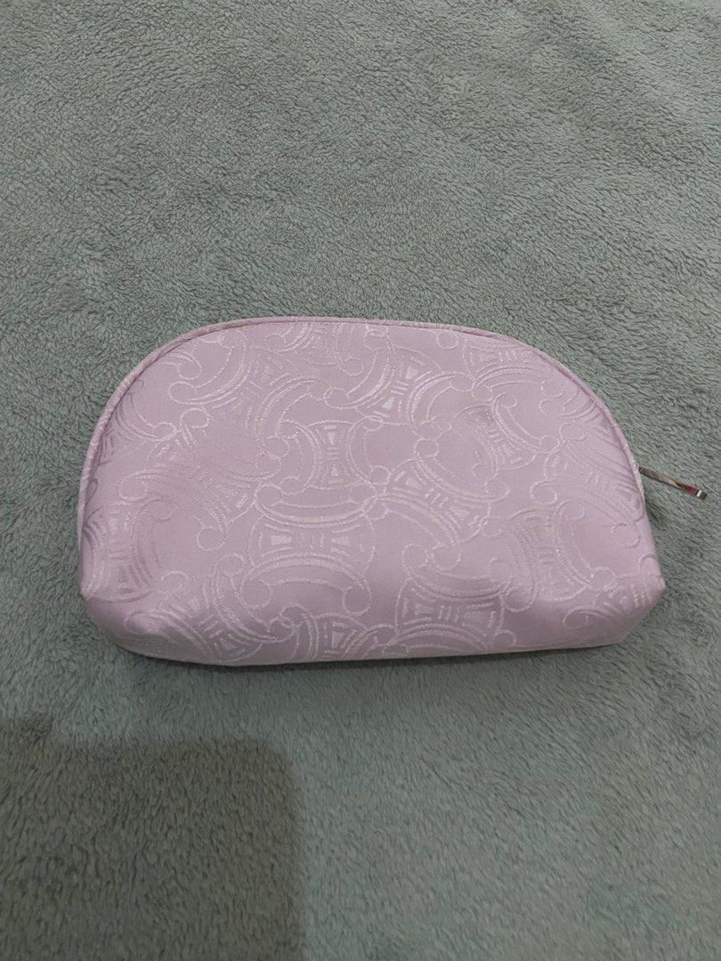 Celine Cosmetic Pouch (Category: Luxury Bags & Wallets) located in Davao. Submitted by mengsmixitems (Listing ID 1405901070, Image 2). Description: - Authentic Celine cosmetic pouch - Light pink exterior with repeating pattern - Silver zipper closure - Small Celine logo on front - Light beige interior - Multiple compartments for organization - Ideal for makeup and small items.
