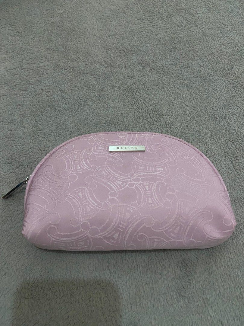 Celine Cosmetic Pouch (Category: Luxury Bags & Wallets) located in Davao. Submitted by mengsmixitems (Listing ID 1405901070, Image 1). Description: - Authentic Celine cosmetic pouch - Light pink exterior with repeating pattern - Silver zipper closure - Small Celine logo on front - Light beige interior - Multiple compartments for organization - Ideal for makeup and small items.