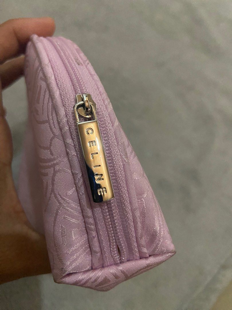 Celine Cosmetic Pouch (Category: Luxury Bags & Wallets) located in Davao. Submitted by mengsmixitems (Listing ID 1405901070, Image 3). Description: - Authentic Celine cosmetic pouch - Light pink exterior with repeating pattern - Silver zipper closure - Small Celine logo on front - Light beige interior - Multiple compartments for organization - Ideal for makeup and small items.