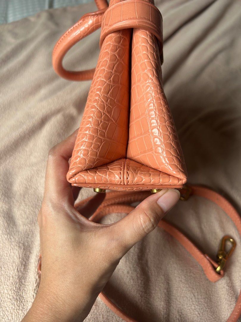 Charles & Keith Croc Effect Handbag Turn Lock Salmon (Category: Luxury Bags & Wallets) located in Cavite. Submitted by jadiejda (Listing ID 1405887874, Image 3). Description: Selling my : Croc Effect Turn Lock Tote Bag - Pink (Salmon) 1 Rubs only and a few scratches on studs You can check it online for authenticity No Paper bag anymore but with Dust Bag Selling for only 1600 FIX SUPER LOW NA RFS: As a mom of three, I can only use it for date nigh