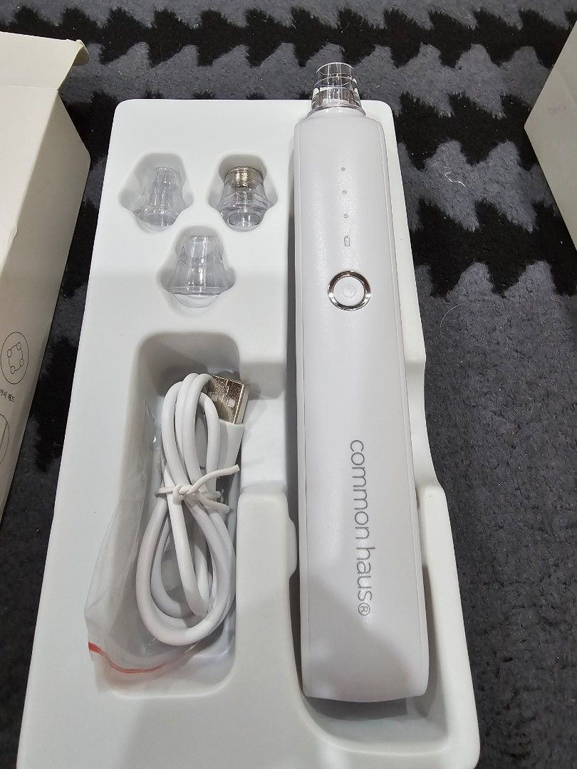 Common Haus Super Sucking Pore Vacuum Cleaner (Category: Face Care) located in Manila. Submitted by katiemaxxie (Listing ID 1405885372, Image 2). Description: - Common Haus pore vacuum cleaner - Removes sebum and blackheads - Comes with multiple attachments - Includes a charging cable - Features an on/off button and indicator lights - Brand new, in original packaging.