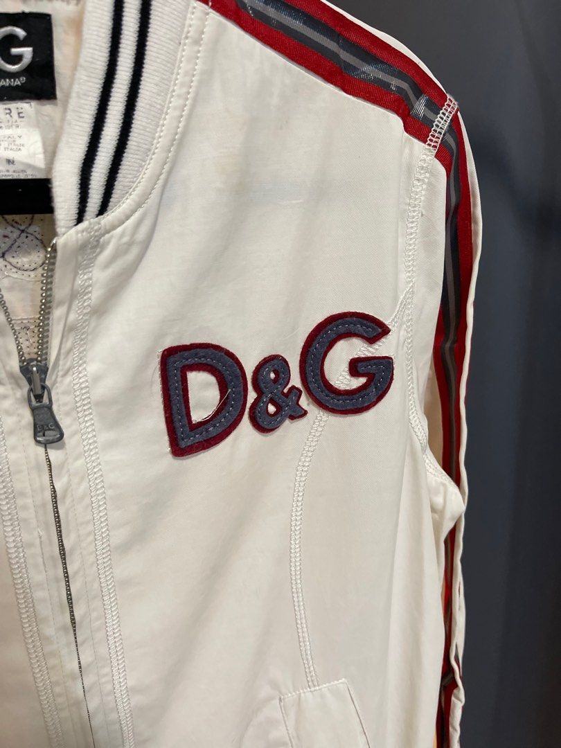 Dolce & Gabbana "Hard Athletes" Track Jacket (Category: Luxury Apparel) located in Makati City. Submitted by angkoljograt (Listing ID 1405842693, Image 3). Description: Made in italy Dimensions - LENGTH : 25 Pit - 20 Shoulders - 16 Sleeve - 24.5 Issue on side tape and very light stains/bleed.