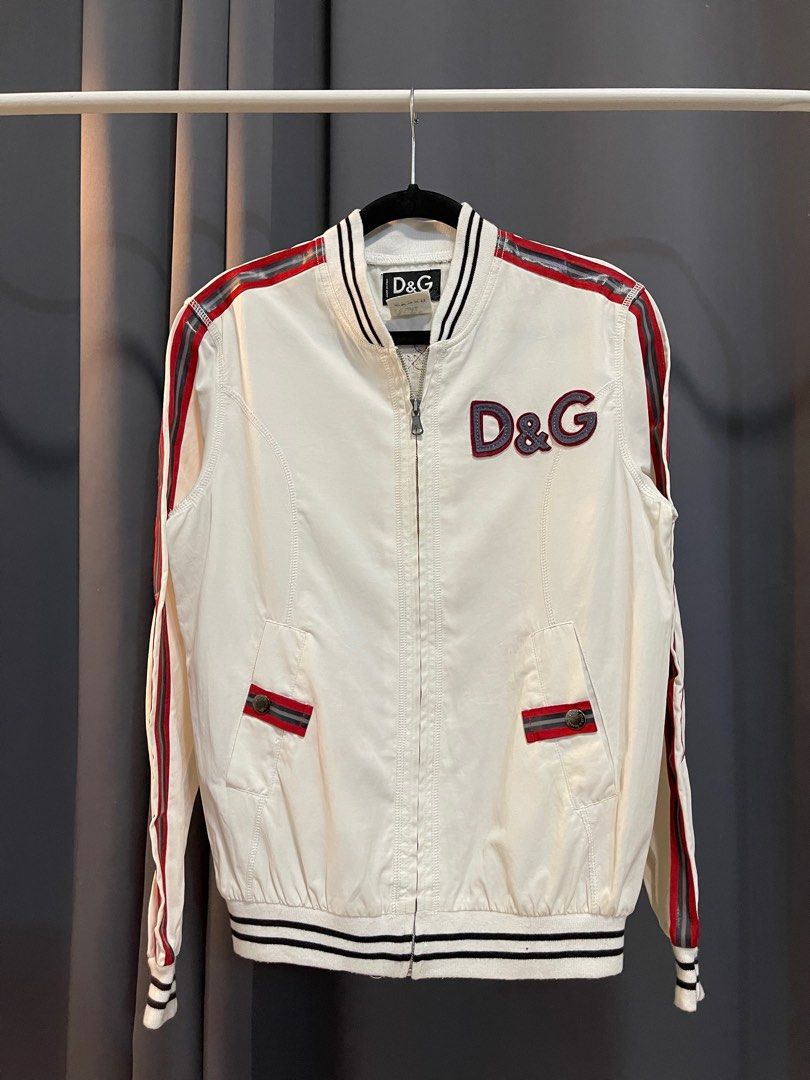 Dolce & Gabbana "Hard Athletes" Track Jacket (Category: Luxury Apparel) located in Makati City. Submitted by angkoljograt (Listing ID 1405842693, Image 2). Description: Made in italy Dimensions - LENGTH : 25 Pit - 20 Shoulders - 16 Sleeve - 24.5 Issue on side tape and very light stains/bleed.