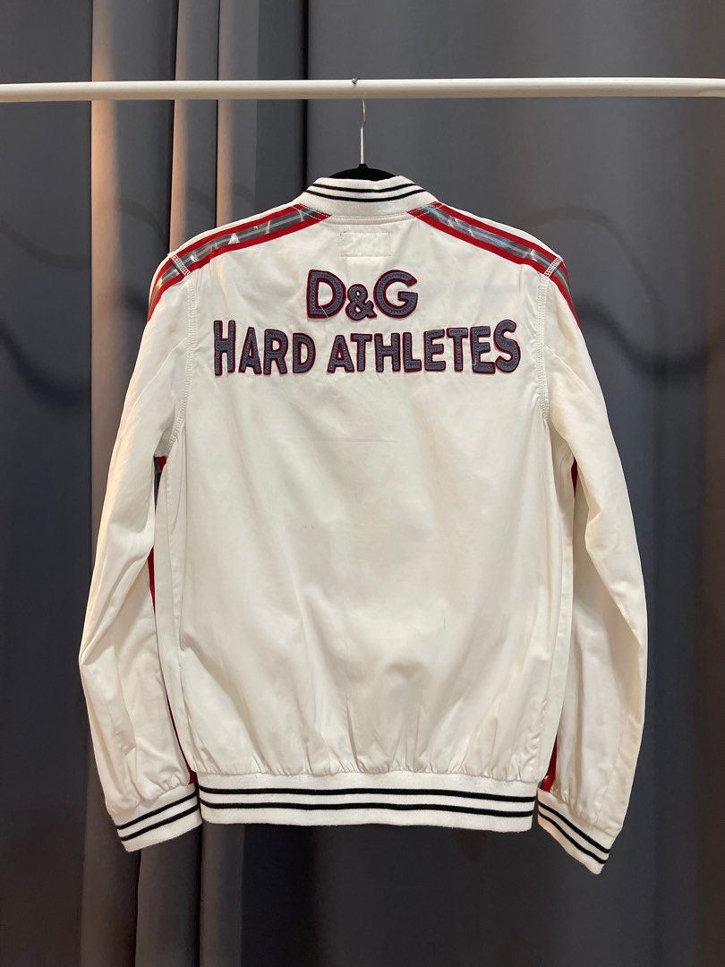 Dolce & Gabbana "Hard Athletes" Track Jacket (Category: Luxury Apparel) located in Makati City. Submitted by angkoljograt (Listing ID 1405842693, Image 1). Description: Made in italy Dimensions - LENGTH : 25 Pit - 20 Shoulders - 16 Sleeve - 24.5 Issue on side tape and very light stains/bleed.