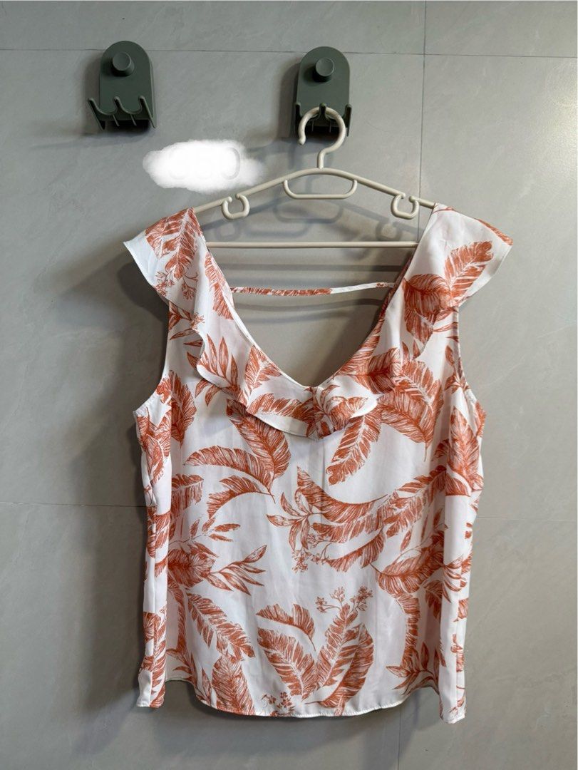Dorothy Perkins Floral Top (Category: Blouses) located in Pasig City. Submitted by superpinya (Listing ID 1405731119, Image 1). Description: - Dorothy Perkins top - Beautiful floral print (white and orange) - V-neckline with ruffle detailing - Unique back design - Sleeveless - Perfect for warm weather.