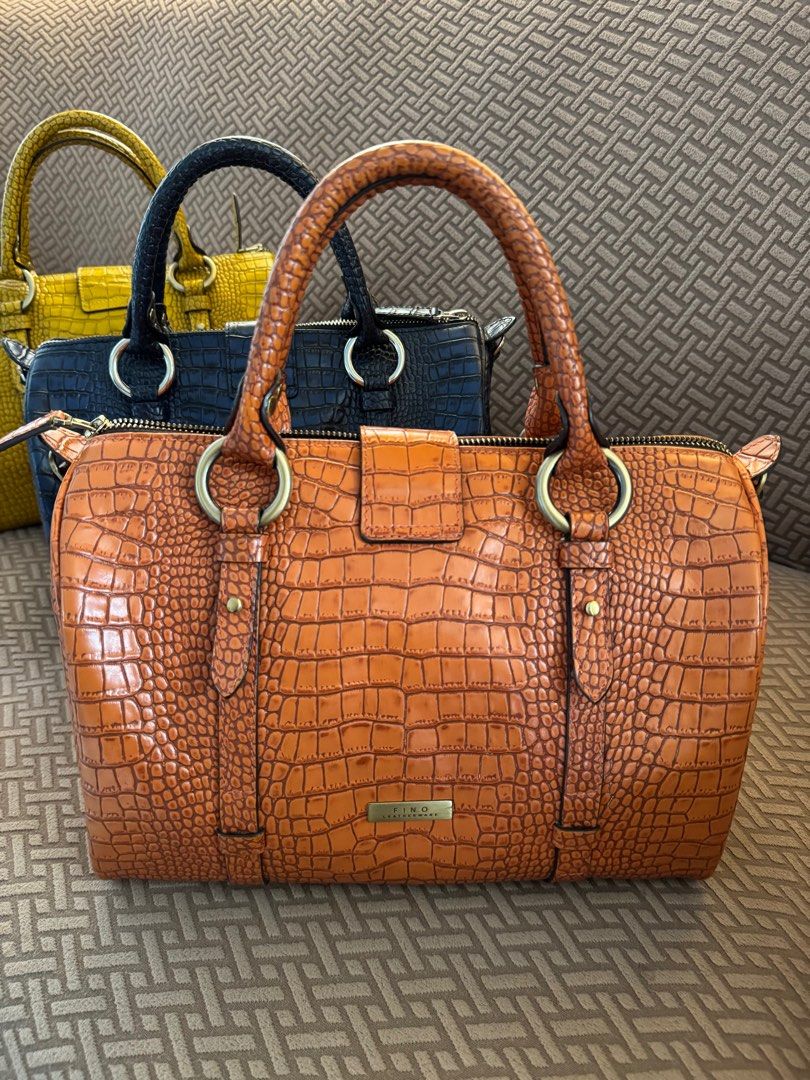 FINO Crocodile-Embossed Handbag (Category: Luxury Bags & Wallets) located in Ozamiz City. Submitted by Maney8 (Listing ID 1405901304, Image 2). Description: With sling strap In excellent condition LP posted #fino #finoleatherware.
