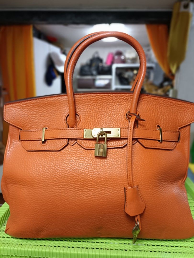 Hermes Orange Leather Handbag (Category: Luxury Bags & Wallets) located in Manila. Submitted by jjm-collections (Listing ID 1405836368, Image 2). Description: may paint na pink or dirt inside with rubbings with minimal signs of use.