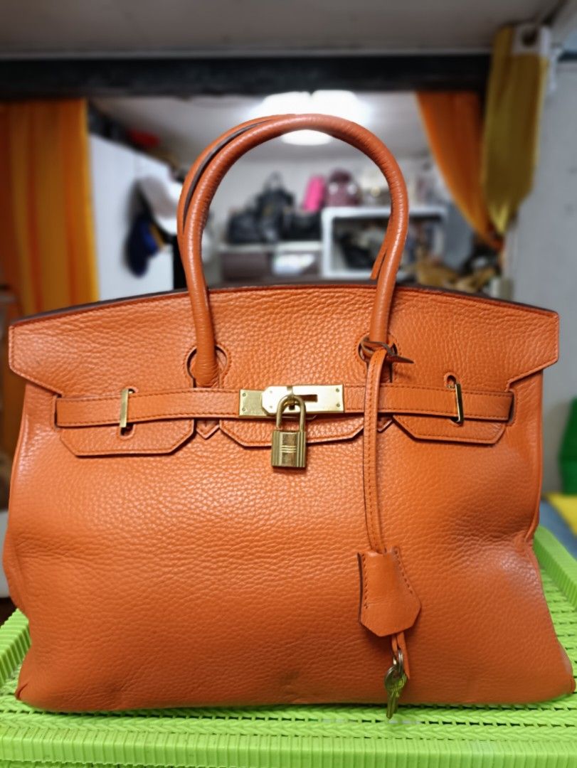 Hermes Orange Leather Handbag (Category: Luxury Bags & Wallets) located in Manila. Submitted by jjm-collections (Listing ID 1405836368, Image 1). Description: may paint na pink or dirt inside with rubbings with minimal signs of use.
