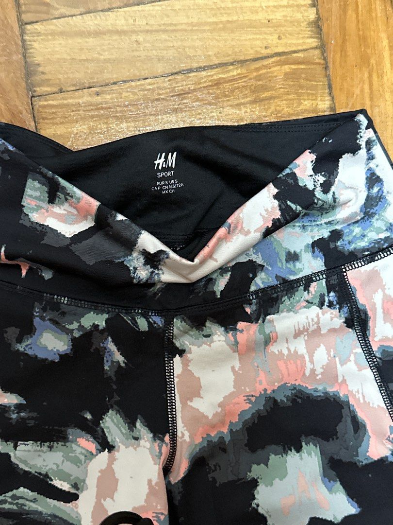H&M Sport Leggings (Category: Activewear) located in Muntinlupa City. Submitted by toomuchstuff17 (Listing ID 1405893145, Image 2). Description: - H&M Sport leggings - Size: S - Design: Colorful abstract pattern - Features: Black waistband - Material: Blend, suitable for sports - Fit: Comfortable and flexible.