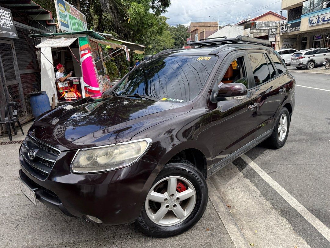Hyundai Santa Fe 2.4 (A) (Category: Used Cars) located in Quezon City. Submitted by checlutter (Listing ID 1405746776, Image 2). Description: For Sale: ✅ 2009 Hyundai Santa Fe ✅ Automatic transmission/Triptronic +/- ✅ 2.2 CRDI diesel turbo intercooler engine ✅ No delay ✅ Good running condition ✅ 7 to 8 seater ✅ Cold Aircon ✅ Power windows/side mirrors ✅ Android LCD monitor with back camera ✅ Leather Seats ✅ No kalampag ✅ No tagas ✅ 18” Advan mags