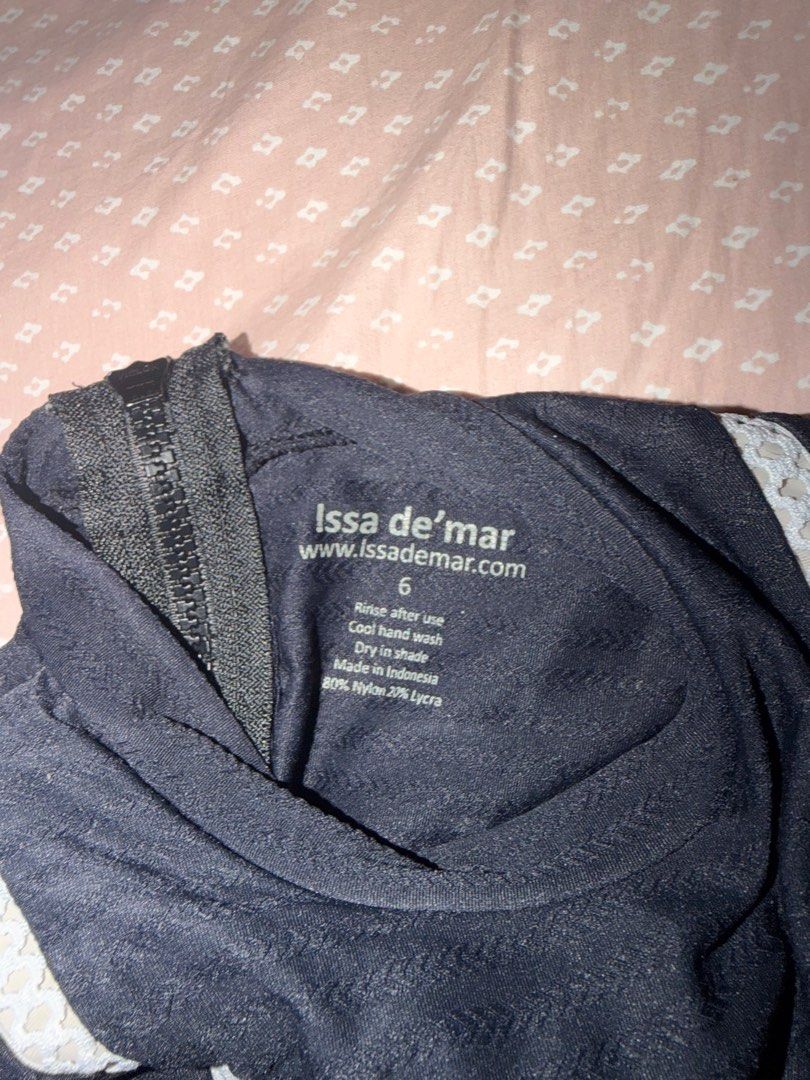 Issa de' mar Long Sleeve Swimsuit Size 6 (Category: Babies & Kids Fashion) located in Tacloban City. Submitted by chaomg (Listing ID 1405875671, Image 3). Description: - Issa de' mar long-sleeved swimsuit - Color: Black - Features: High neck, front zipper, white side stripes - Material: 80% Nylon, 20% Lycra - Size: 6 - Made in: Indonesia - Care: Cool hand wash, dry in shade MOP: GCash/Maya Payment (last price posted) MOP: GCash/Maya Payment.