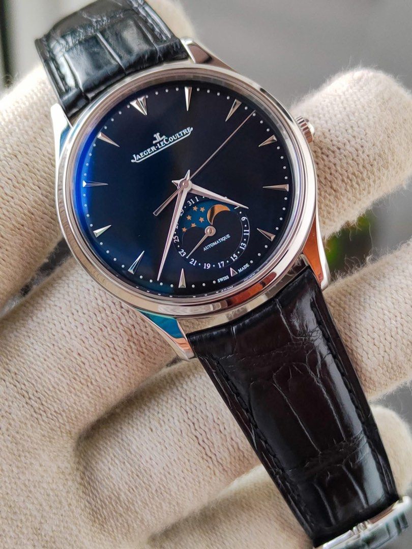 Jaeger-LeCoultre Master Ultra Thin Moon 39 (Category: Luxury Watches) located in Manila. Submitted by kristinepenafiel (Listing ID 1405900679, Image 3). Description: - Jaeger-LeCoultre Master Ultra Thin Moon 39 - Black dial with moon phase indicator - Automatic movement - Stainless steel case - Leather strap with deployment clasp - Includes original box and papers - Showcases intricate movement on the back.