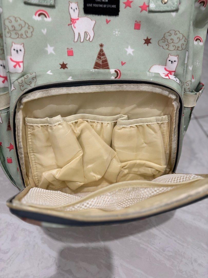 LAND Mommy & Baby Bag (Category: Diaper Bags & Wetbags) located in Calamba. Submitted by namsun101 (Listing ID 1405820556, Image 3). Description: - Cute llama print mommy bag - Multiple compartments for organization - Includes side and interior pockets - Top handle and adjustable straps - Durable material - Secure zipper closure - Designed for baby essentials.