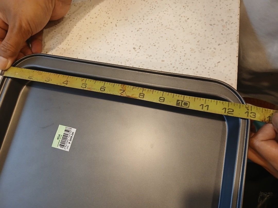 Large Baking Tray (Category: Bakeware) located in Las Pinas. Submitted by zera23 (Listing ID 1405788812, Image 3). Description: - Unused large non-stick baking tray - Made of aluminum metal - Dimensions: Approximately 19 inches long x 13 inches wide x 1 inch deep - A few minor, small dents that were already there when I bought the tray. - Reason for selling: the tray is too big and does not fit our oven..