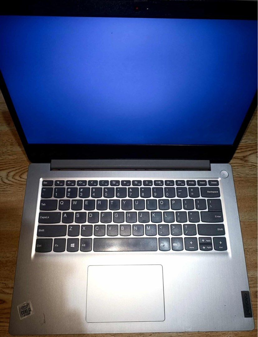 Lenovo Laptop (Category: Laptops & Notebooks) located in Mandaluyong City. Submitted by lauriedjs (Listing ID 1405721570, Image 2). Description: - Silver Lenovo laptop - Full-sized keyboard - Built-in webcam - Touchpad included - 'Intel Inside' sticker present - Screen displays a blue background.