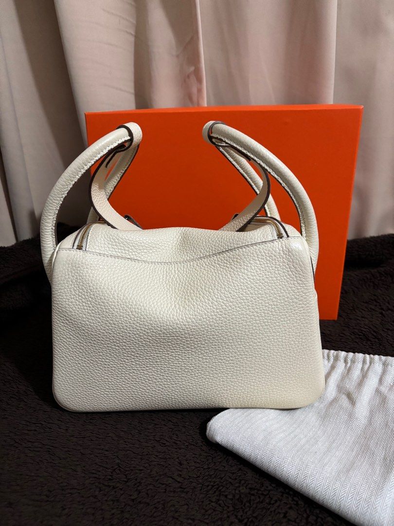 Lindy 26 Nata (Category: Luxury Bags & Wallets) located in Paranaque City. Submitted by declutterqueeen (Listing ID 1405874344, Image 2). Description: - Lindy size 26 - Color: Nata - Includes: Orange Box & Dust Bag - Design: Structured with dual top handles and turn-lock closure - Genuin togo leather in Nata - Hardware: Gold - has no stamp / logo.