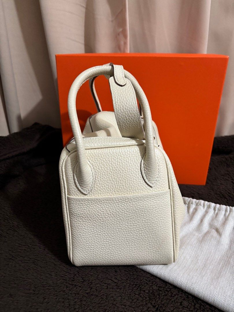 Lindy 26 Nata (Category: Luxury Bags & Wallets) located in Paranaque City. Submitted by declutterqueeen (Listing ID 1405874344, Image 3). Description: - Lindy size 26 - Color: Nata - Includes: Orange Box & Dust Bag - Design: Structured with dual top handles and turn-lock closure - Genuin togo leather in Nata - Hardware: Gold - has no stamp / logo.