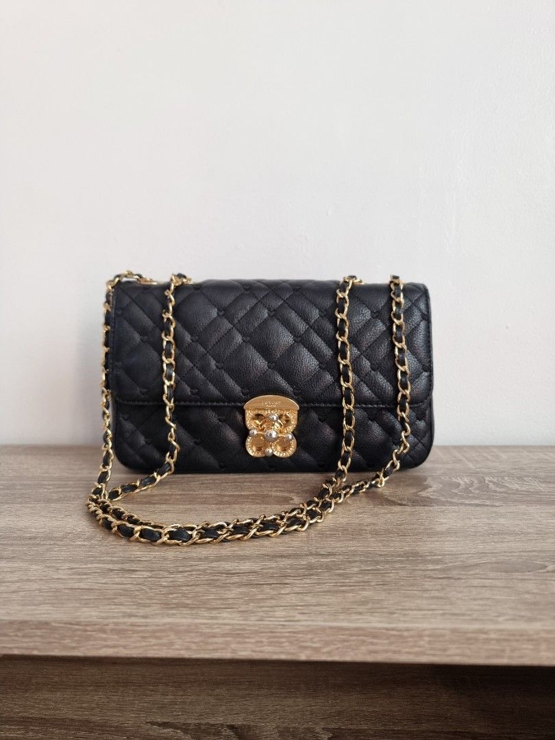 Lovcat Paris Black Quilted Chain Bag (Category: Luxury Bags & Wallets) located in Cebu City. Submitted by ohpetite (Listing ID 1405773860, Image 1). Description: - Lovcat Paris black quilted handbag - Cebu City - firstpayment basis - Gold-tone chain strap, hardware - a bit of fading on the lock but not noticeable - Decorative clasp - Spacious interior with branded label - Diamond-patterned stitching - Flap closure .
