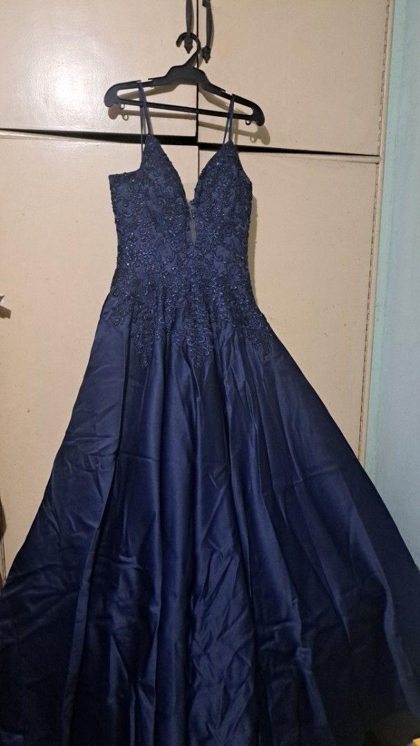 Navy Blue Prom Dress (Category: Evening dresses & gowns) located in Manila. Submitted by cyj08 (Listing ID 1405869304, Image 2). Description: - Elegant navy blue formal gown - V-neckline with intricate lace detailing - Flowing skirt, ideal for special occasions - Designed with spaghetti straps - Subtle sheen fabric for a sophisticated look.