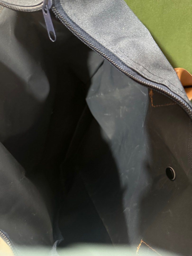 Navy Blue Tote Bag with Brown Handle (Category: Tote Bags) located in Taguig. Submitted by sshyn_08 (Listing ID 1405745439, Image 3). Description: - Navy blue tote bag - Brown handles - Flap closure - Zipper closure at the top - Spacious interior - Made of durable material - Versatile for everyday use.