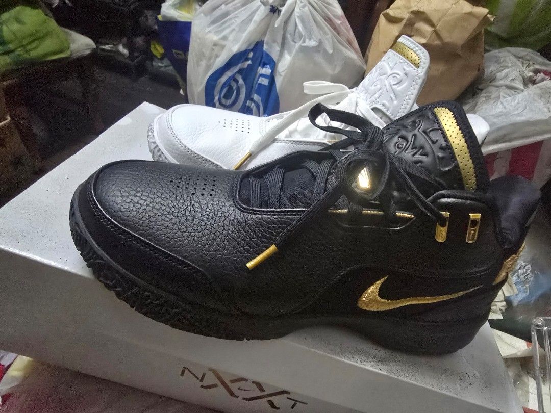 Nike LeBron NXXT Gen AMPD EP Sneakers (Category: Sneakers) located in Manila. Submitted by andrew15o (Listing ID 1405788271, Image 3). Description: - Nike LeBron NXXT Gen AMPD EP - Color: Black and White - Size: US 11 - Features gold accents - "EQUITY" branding on heel - Includes original box - Unique sole pattern.