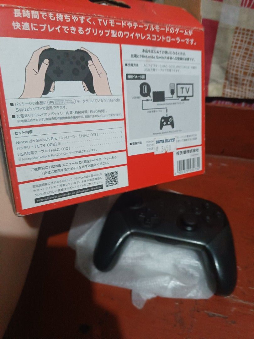 Nintendo Switch Pro Controller and accessories (Category: Controllers) located in San Juan City. Submitted by jeffstyle10 (Listing ID 1405752237, Image 3). Description: For sale Nintendo switch pro controller (black), joycon straps, game holder and amiibo Zelda mini card Issue for controller: Battery for replacement Negotiable Offer Reason for selling needs cash and sold switch consoles. Pick up House Location San Juan City.