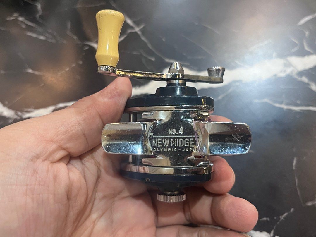 Olympic New Midget No. 4 Fishing Reel baitcaster (Category: Fishing) located in Singapore. Submitted by makeoldstuffnew (Listing ID 1405820546, Image 5). Description: Rare vintage baitcaster reel collectables. Type: Miniature baitcasting reel (double axis reel). Best Use: Small freshwater species, such as shrimp or trout. Cast-able but old technology requires you to exercise thumb control to avoid bird nest. Vintage: As a vintage model, it is als